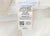 A white fabric label on the Creative Bedding Fossfill Pillow | Antibacterial by Creative Bedding reads: “TAG NOT TO BE REMOVED EXCEPT BY THE CONSUMER. All new material: 50% olefin, 50% polyester.” It includes certification, manufacturer info, and “Made in U.S.A.”.