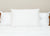 The Pillow Factory Housekeeper's Choice Heavenly Spiral Pillow, featured at many Borgata Hotel Casino & Spa® locations, is a white hypoallergenic pillow that provides hotel-quality comfort and support for your bed.