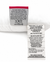 A close-up of two fabric care tags on the Manchester Mills Envirosleep Gold Plus Pillow | Firm Polyester Fiber Fill, showing washing instructions, 100% polyester fiber content, and “Made in Pakistan, filled and finished in the USA.”.