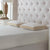 A bed with pillows on it, including a La-Z-Boy Hybrid Bliss Memory Foam Pillow featuring a moisture-wicking cover for added comfort.
