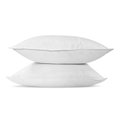 Two stacked, fluffy white Pillowtex pillows with White Duck Feather & Down pillow insert isolated on a clean white background, suggesting comfort and simplicity in home decor.
