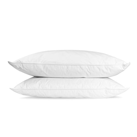 Two fluffy white Pillowtex Hotel Feather and Down Pillows stacked on top of each other, isolated on a white background, suggesting softness and comfort for restful sleep.