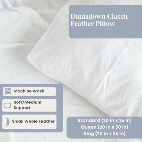 A Daniadown Classic Feather Pillow for side sleepers rests on a white bedspread, accentuating its machine wash compatibility, medium support, small whole feather content, and available sizes in standard and king.