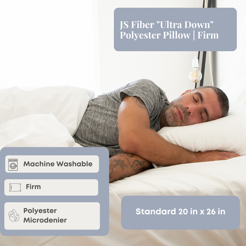 A man is sleeping comfortably on a JS Fiber "Ultra Down" Polyester Pillow | Firm.