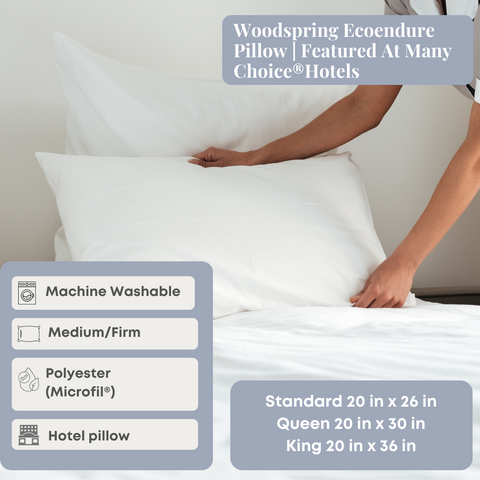 A woman is placing a Woodspring Ecoendure Pillow by Keeco on a bed.