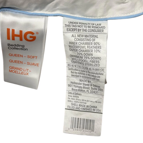 A label with the word "Holiday Inn" on it is found on bedding.