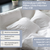 A bed with two white pillows and a white comforter displays the Manchester Mills Envirosleep Gold Plus Pillow, a hotel-quality, hypoallergenic pillow with firm polyester fiber fill. Machine washable. Available in Standard, Queen, and King sizes.