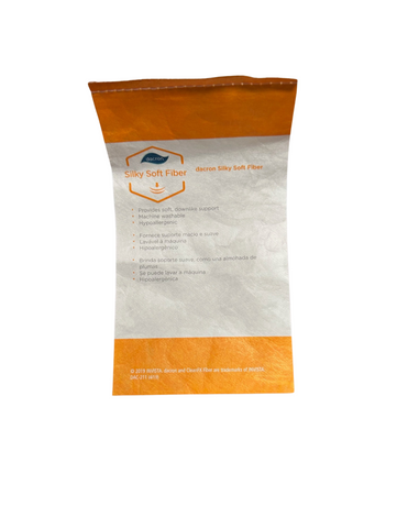 An orange and white JS Fiber Comforel® pillow tag highlighting "silky soft fiber" with bullet points about its soft, down-like support, washability, hypoallergenic properties, and a trademark.