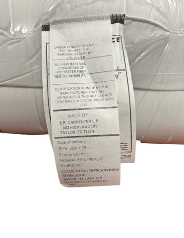 A white law label on a Carpenter Perfect Choice Gold Pillow detailing material content, including antimicrobial treated polyester and down alternative pillow fill, and certification by the manufacturer, e.s. kluft & company.