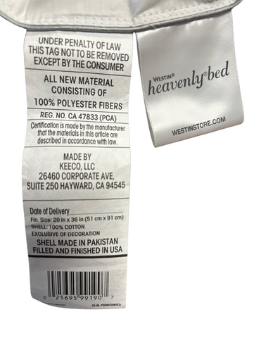 A label affixed to a hypoallergenic Hollander Westin® Heavenly Soft Support Polyester Bed Pillow, detailing material composition, care instructions, manufacturer's information, size (51x91 cm), and place of manufacture (Pakistan).