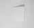 An Extra-Wide 30” Wedge Pillow by Sleep Again Pillows rests on a clean white surface, its firm foam and smooth, rectangular design highlighted by soft shadows—perfect for back and leg support in any minimalist setting.