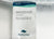 A product tag for the JS Fiber Hollofil II Pillow | Medium by JS Fiber features white fabric with blue text, stating it’s filled with Hollofil II fiberfill for lasting loft and support—machine wash warm, mild detergent, tumble dry low.