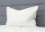 The Pillowtex Triple Core White Duck Down & Feather Pillow offers medium-soft support, ideal for side and back sleepers. Its white design pairs perfectly with a quilted comforter for a clean, minimalist bedroom look.