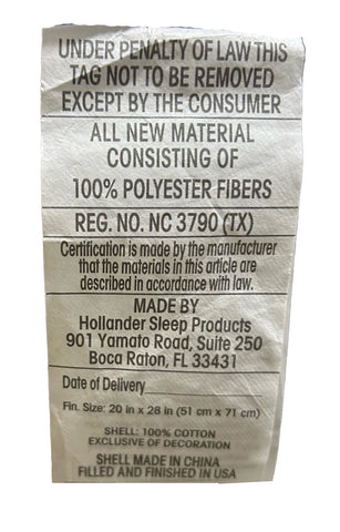 A crumpled clothing tag specifying the material as 100% polyester fibers with Great Sleep Cooling Pillow from Hollander and moisture wicking properties, manufacturer details, and care instructions under penalty of law removal specifics, with a visible