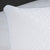 Close-up of the Carpenter Comfort Tech Bed Pillow Featuring Tranquility Foam, designed for side sleepers with a geometric pattern and 37.5 technology for enhanced comfort, shown on a matching mattress against a calming, softly blurred background.