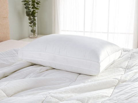 A Carpenter Co. Dual Layered Comfort Pillow | Extra-Firm Support on the bed is ideal for side sleepers.