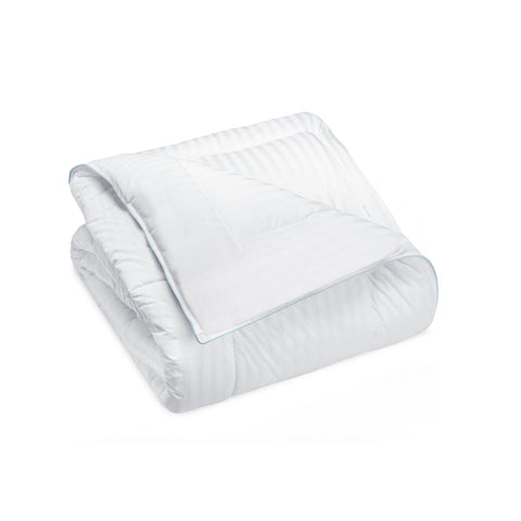 A neatly folded Manchester Mills Prelude II Blanket in Traditional Size, with blue piping, isolated on a white background, highlighting its fluffy texture and lightweight design ideal for comfortable sleep. Featuring an antimicrobial polyester fill, it also offers hypoall