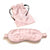 A 100% Mulberry silk sleep eye mask with matching drawstring pouch, featuring soft, ruffled edges and black elastic bands, arranged on a white background for a serene sleep accessory display. (Brand Name: Pillows.com)