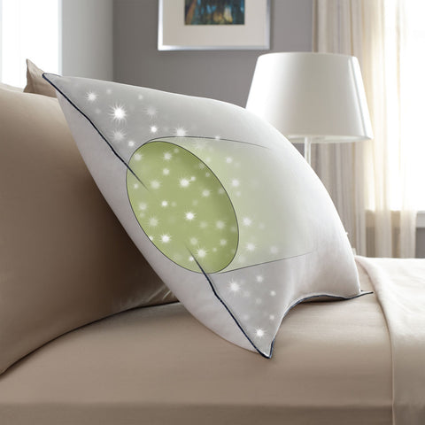 A Pacific Coast Feather Grand Embrace® Pillow with a star on it rests on the bed.