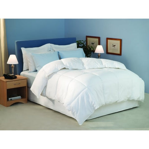 A Restful Nights Royal Loft Polyester Comforter in a bedroom with blue walls.