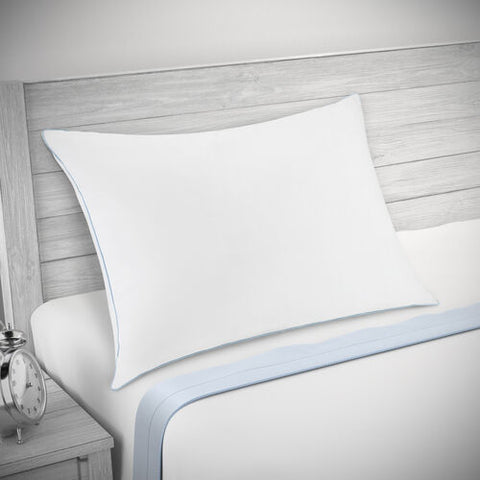 A Restful Nights Renova™ Pillow on top of a bed provides support and is eco-friendly.