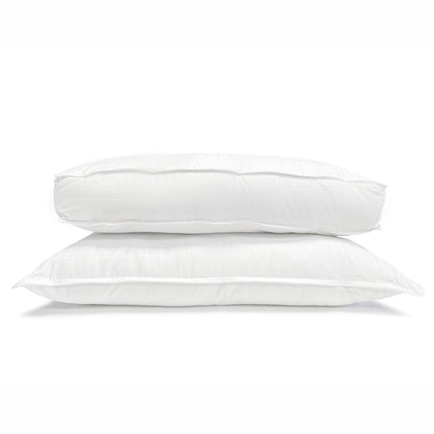 Two white Carpenter Co. Beyond Down Side Sleeper Pillows stacked on top of each other.