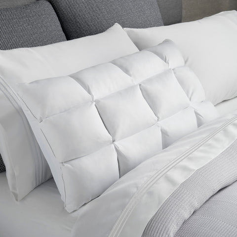 A white PureCare Cooling SoftCell® Chill Pillow is placed on a bed, featuring FRIO fibers for cooling comfort.