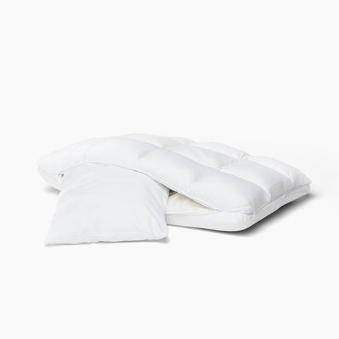 A white PureCare SoftCell Select Pillow on a white surface.