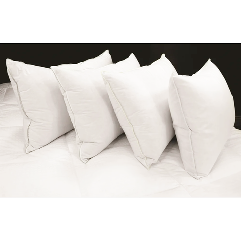 A stack of four fluffy white pillows showcases the Manchester Mills Down Dreams Classic Soft & Firm Combo Pack design.