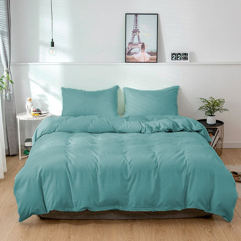 A bed in a room with a Pillowtex Bamboo Duvet Cover for Weighted Blanket made of bamboo.