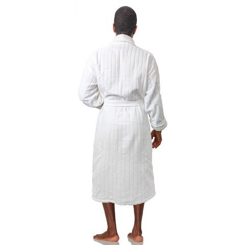 A woman in a white Pillowtex Hotel Robe standing in front of a white wall.