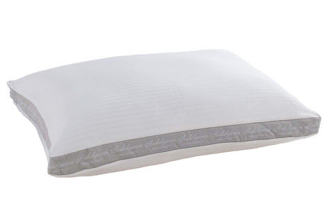 A rectangular, white Indulgence® Synthetic Down Pillow | Side Sleeper with a subtle striped pattern and decorative script text along the trim, showcased isolated on a plain white background.