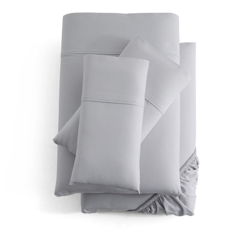 Malouf Bamboo Sheet Set with ruffled pillowcases made from bamboo fibers, perfect for sensitive skin.