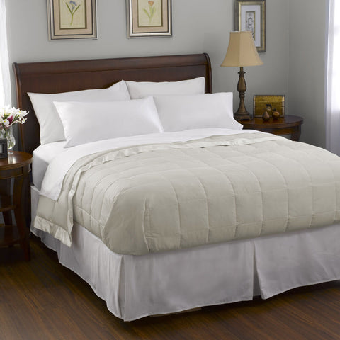 A white bed with a Pacific Coast Feather Company Satin Trim Blanket | White Goose Down comforter.