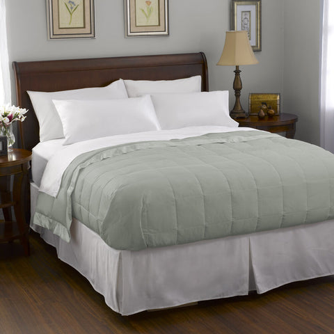 A bed with a Pacific Coast Feather Company Satin Trim Blanket | White Goose Down comforter.