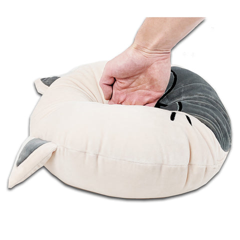 A person is holding a Squishy Cat Face Pillow with Floppy Ears | Cornelius The Cat, perfect for incentivizing sleep in children from Pillowtex.