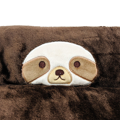A Pillowtex sloth themed plush animal pillow with a brown and white face, perfect for snuggling.