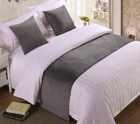 A bed with a pink and gray striped duvet cover and Final Sale: Pillowtex Faux Suede Bed Scarf.