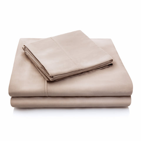A set of eco-friendly Malouf Tencel bed sheets on a white background.