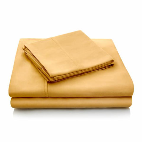 A tan Malouf Tencel Pillowcase Set made from eco-friendly Tencel fabric on a white background.