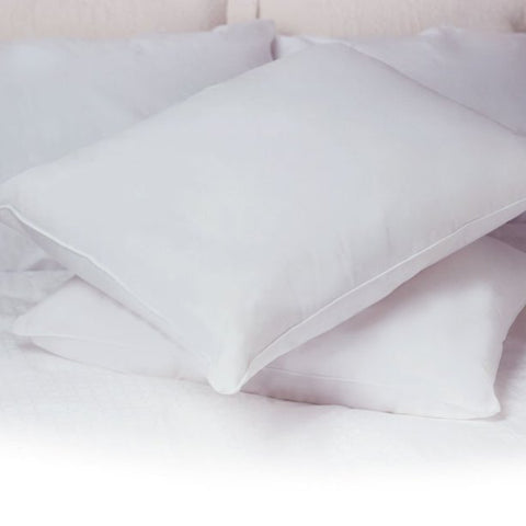 Two Restful Nights Renova™ Eco-Friendly White Pillows providing support on top of a bed.