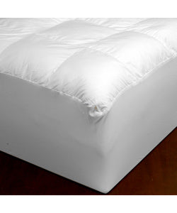 A Carpenter Co. Beyond Down Mattress Pad with a white cover on it is sure to help you SleepBetter.