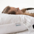 A woman peacefully sleeping on a soft Envirosleep Hypoallergenic Luxury Suite Package pillow by Manchester Mills.