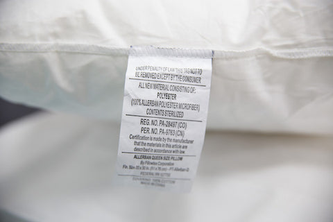 A close up of a hypoallergenic label on a Final Sale: Pillowtex Allerban Polyester Pillow.