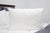 A supportive Pillowtex® Premium Polyester Pillow | Extra Firm on the bed for side sleepers.