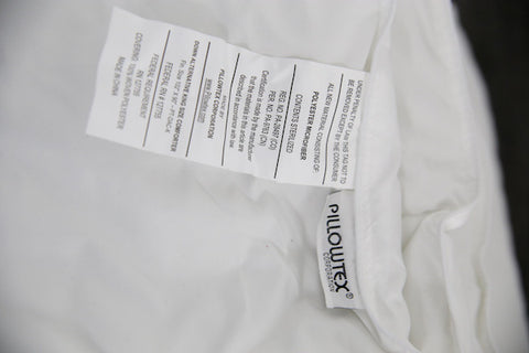 A close up of a label on a Pillowtex Classic Weight Down Alternative Comforter/Duvet.