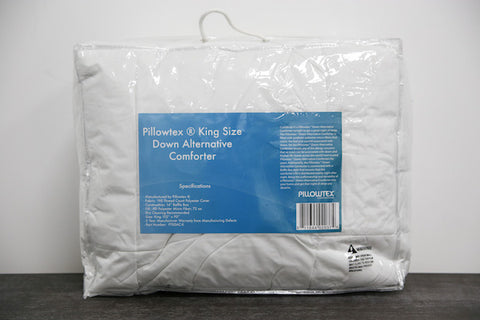 An image of a Pillowtex Classic Weight Down Alternative Comforter/ Duvet on a table.
