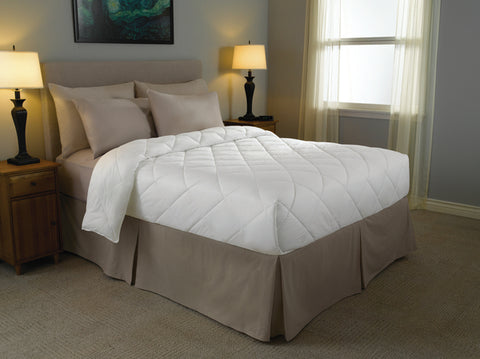A white Renova™ Fiber Blanket | Diamond Box Design comforter on the bed provides ultimate comfort.
