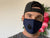 A man wearing a pillowsdotcom Final Sale: Reusable Cotton Face Mask with Valve & Carbon Filter - 2 Pack.