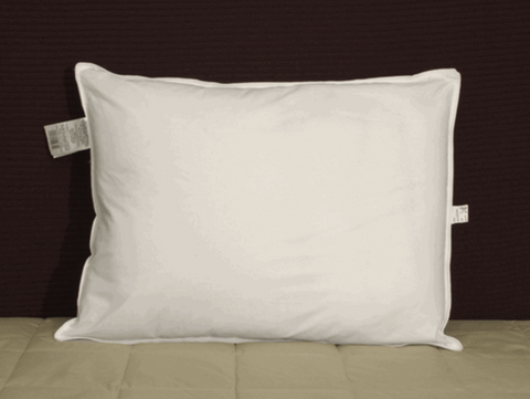 A white pillow with the Restful Nights Ultra Essence Pillow label on it.